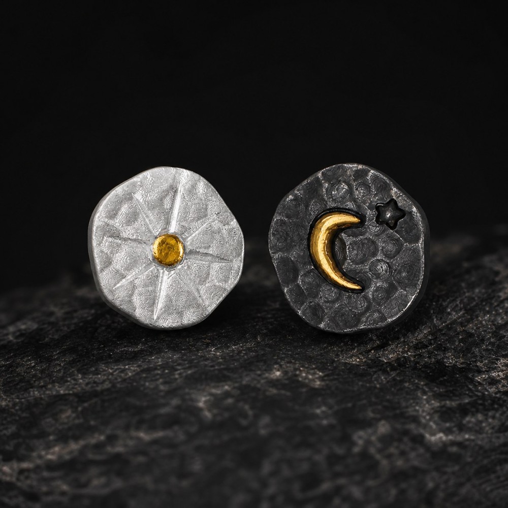 Sun and moon stud earrings made from fine silver with small gold details