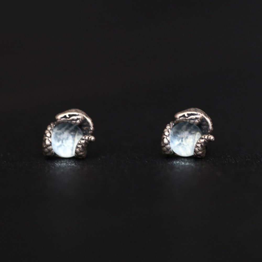 Side view of a 925 sterling silver snake stud earring showing the post and sculptural profile